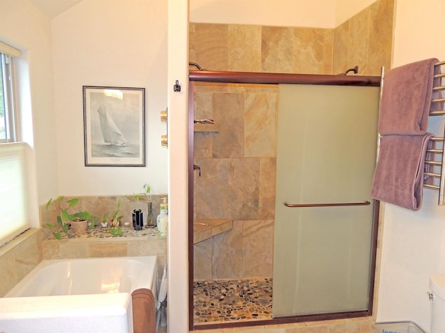 35025 Mourning Dove Ln N, Davenport, WA 99122 - full bathroom with a bath, a shower stall, a towel warming rack, and toilet