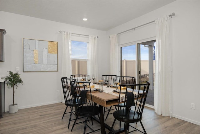 dining space featuring hardwood / wood-style floors