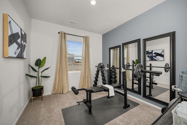 exercise room with carpet flooring