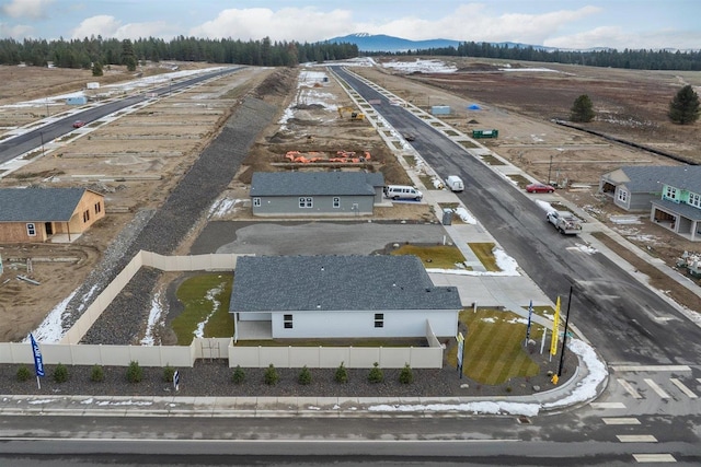 birds eye view of property featuring a mountain view