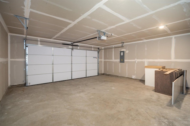 garage featuring a garage door opener and electric panel