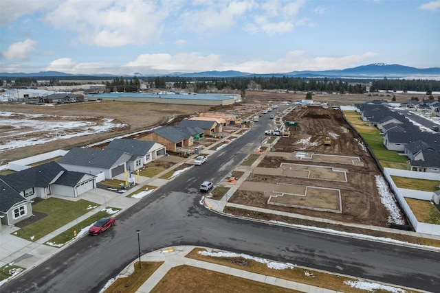 drone / aerial view featuring a mountain view