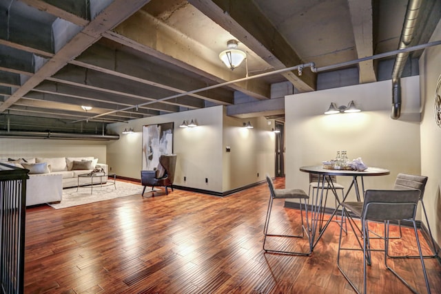 basement with dark hardwood / wood-style flooring