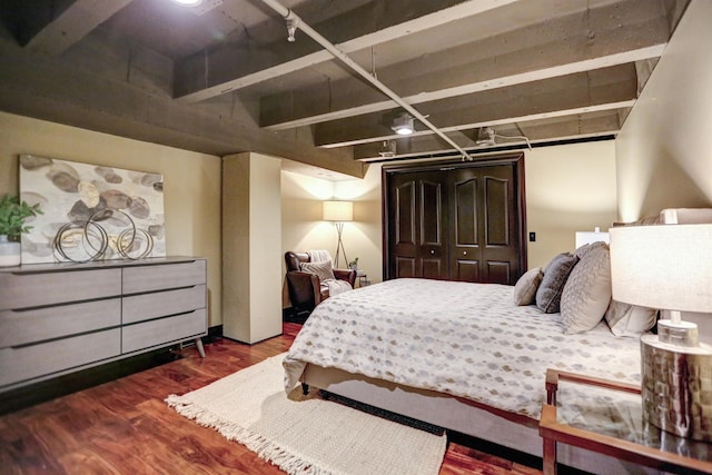 bedroom with dark hardwood / wood-style flooring