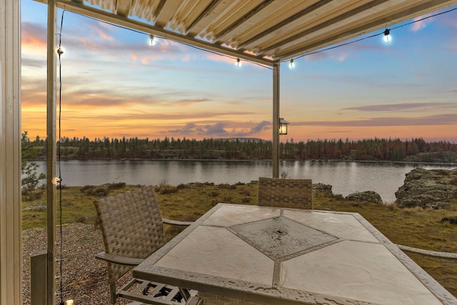 patio terrace at dusk with a water view