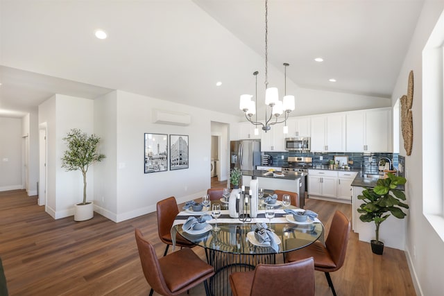 dining area with lofted ceiling, sink, dark wood-type flooring, a wall mounted air conditioner, and a chandelier