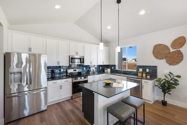 kitchen featuring white cabinetry, appliances with stainless steel finishes, sink, and decorative backsplash