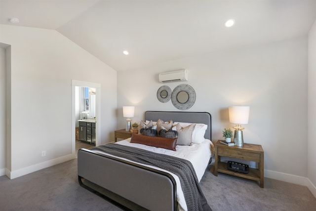 carpeted bedroom featuring lofted ceiling, connected bathroom, and a wall unit AC