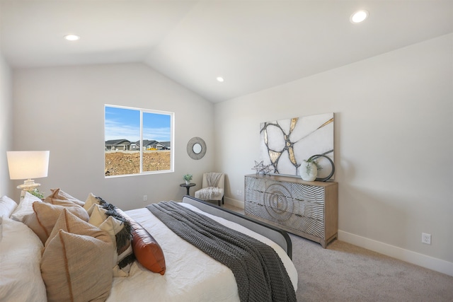 bedroom featuring vaulted ceiling and light carpet