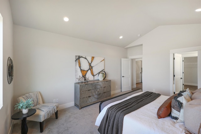 bedroom featuring vaulted ceiling and light colored carpet