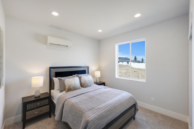 bedroom with light carpet and a wall unit AC