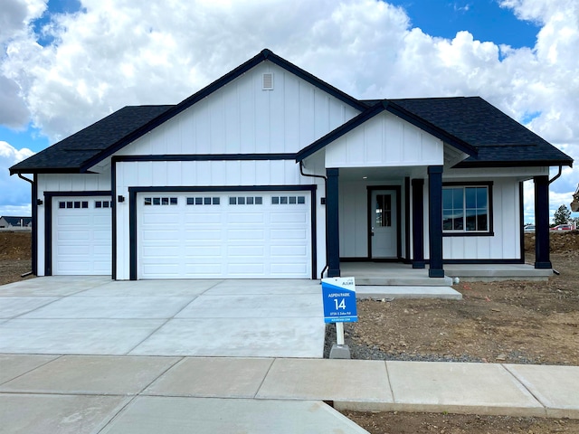 view of front of home with a garage and covered porch