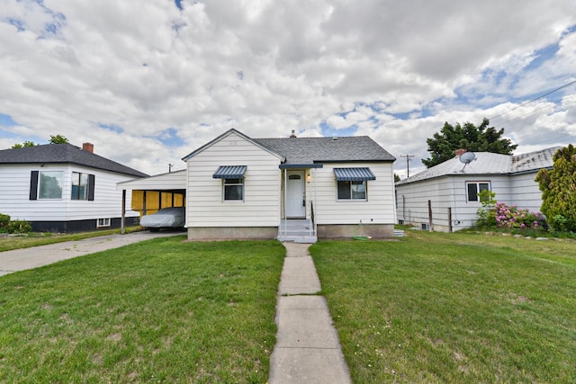 bungalow-style house featuring a front yard