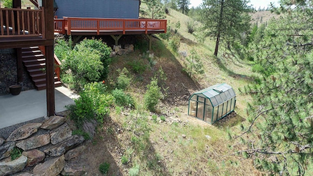 view of yard with a wooden deck