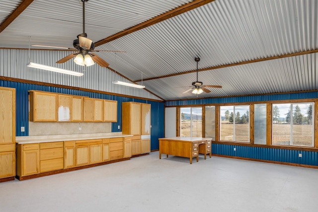 unfurnished sunroom with ceiling fan and vaulted ceiling