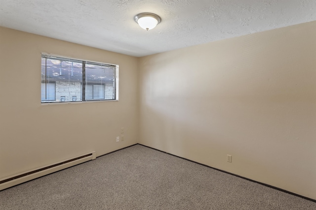 spare room with a textured ceiling, carpet flooring, and baseboard heating