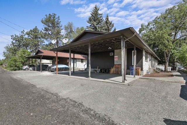 view of parking / parking lot with a carport