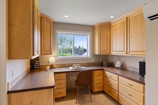 office area featuring built in desk and a wall unit AC