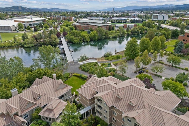 aerial view featuring a water and mountain view