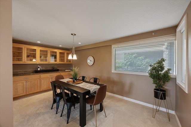 dining area with light colored carpet