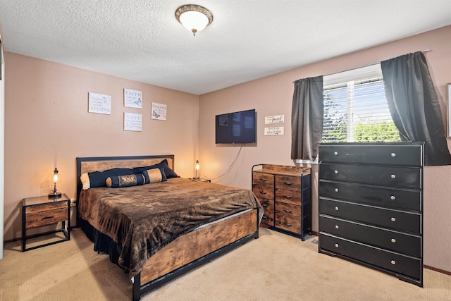 carpeted bedroom with a textured ceiling