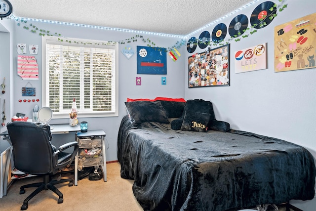 bedroom featuring a textured ceiling and carpet flooring