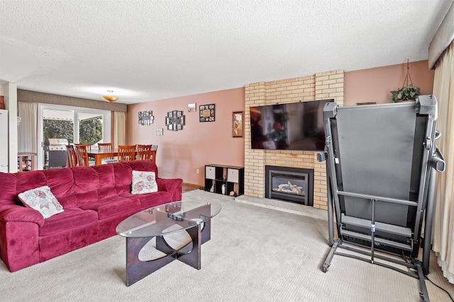 carpeted living room with a fireplace and a textured ceiling