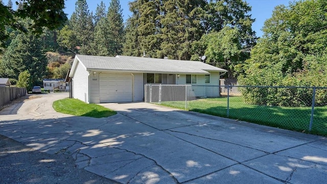 view of front of house featuring a garage and a front yard