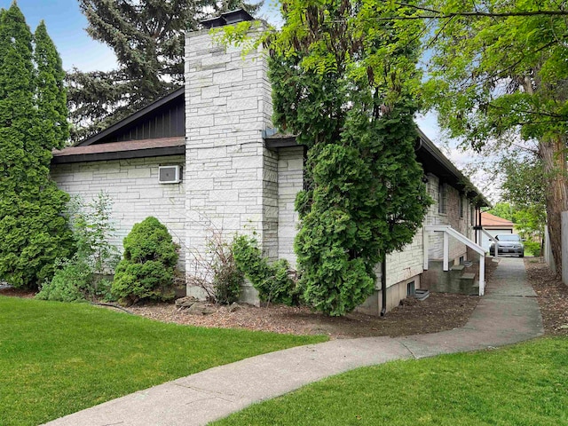 view of home's exterior with a yard