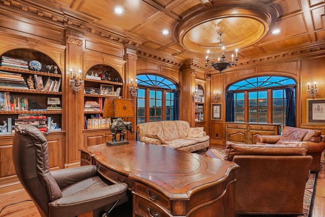 office featuring light hardwood / wood-style flooring, coffered ceiling, wooden walls, and wood ceiling