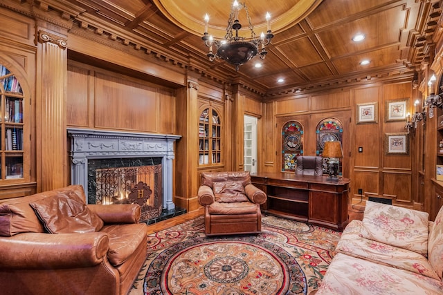 living room with a fireplace, wood walls, wooden ceiling, and coffered ceiling