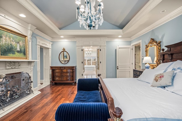 bedroom with a tray ceiling, crown molding, dark hardwood / wood-style flooring, and vaulted ceiling