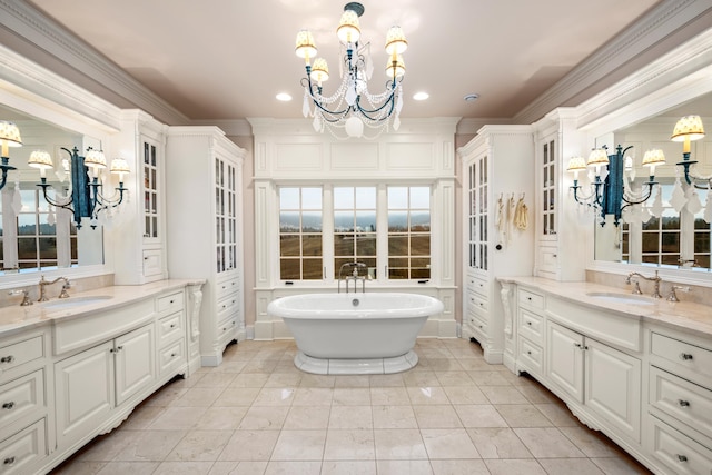 bathroom with a tub, tile patterned floors, and double sink vanity