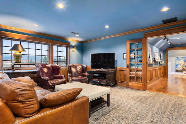 living room featuring wood-type flooring and crown molding