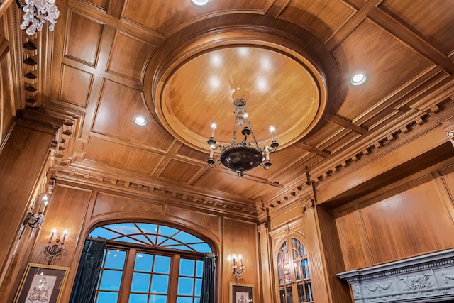 interior details with wood walls, coffered ceiling, and wood ceiling