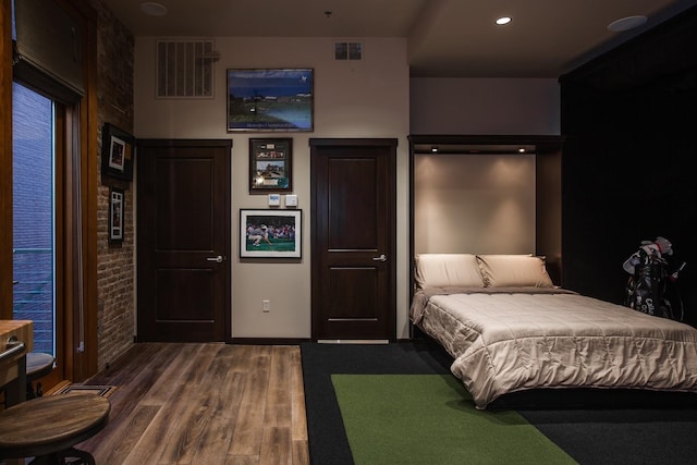 bedroom featuring hardwood / wood-style flooring