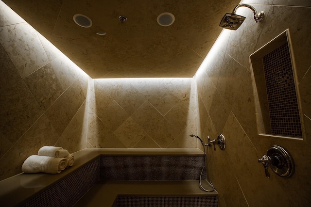 bathroom with a tile shower