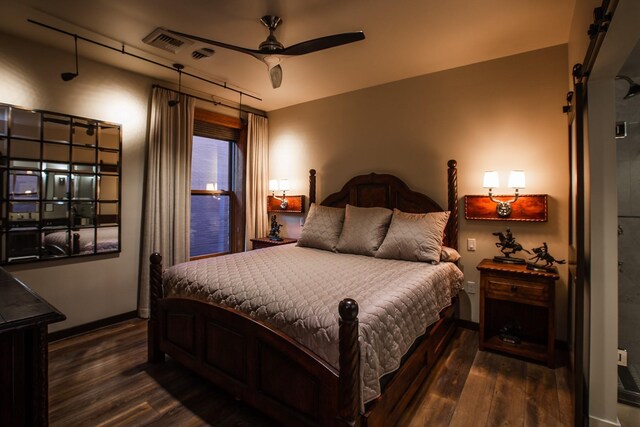 bedroom with ceiling fan and dark wood-type flooring