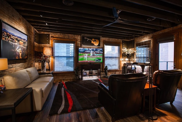 living room with hardwood / wood-style flooring and a healthy amount of sunlight