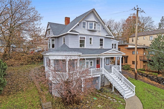 611 S Bernard St, Spokane, WA 99204 - view of front of house featuring roof with shingles, a porch, stairway, and a chimney