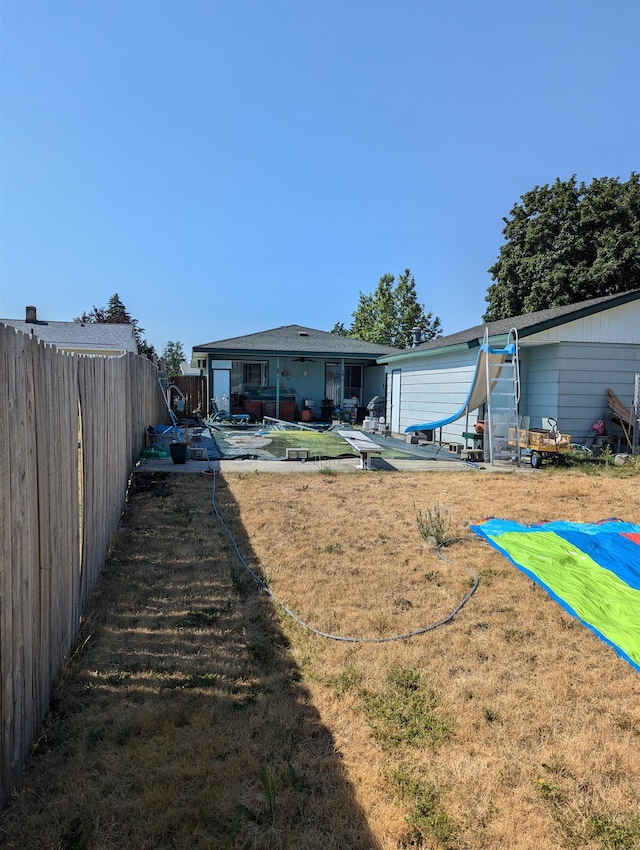 view of yard with a fenced backyard and a patio