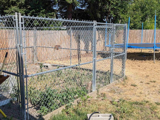 view of gate featuring fence