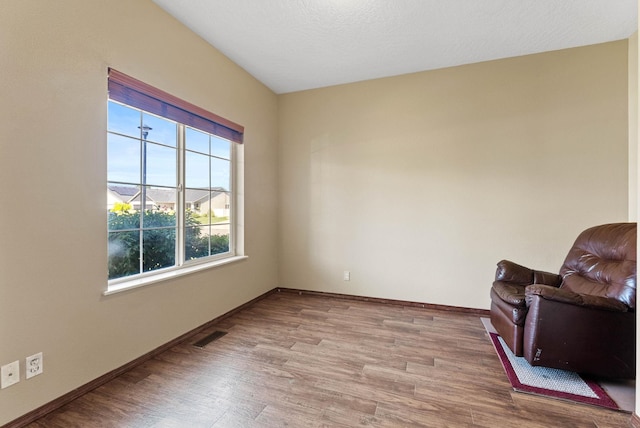 living area with light hardwood / wood-style flooring