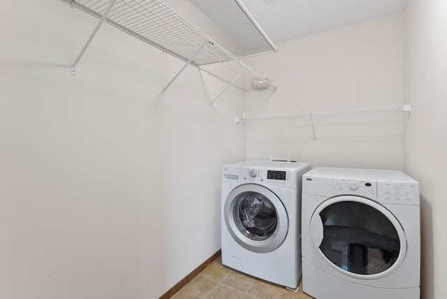 clothes washing area featuring separate washer and dryer