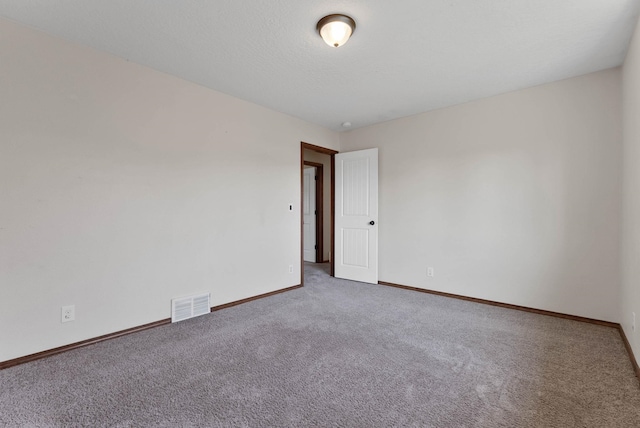 unfurnished room featuring carpet flooring