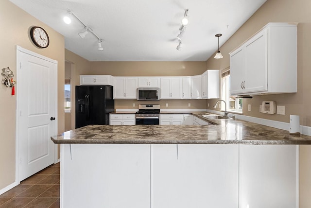 kitchen featuring sink, appliances with stainless steel finishes, white cabinetry, decorative light fixtures, and kitchen peninsula