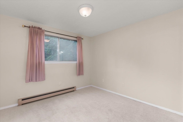 carpeted empty room with baseboard heating