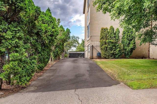 view of side of home with a lawn