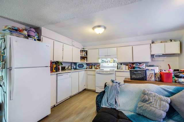 kitchen featuring white cabinetry, white appliances, light wood-type flooring, and a textured ceiling