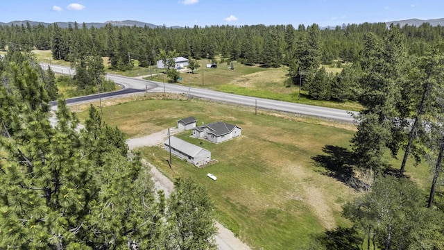 aerial view featuring a mountain view and a wooded view